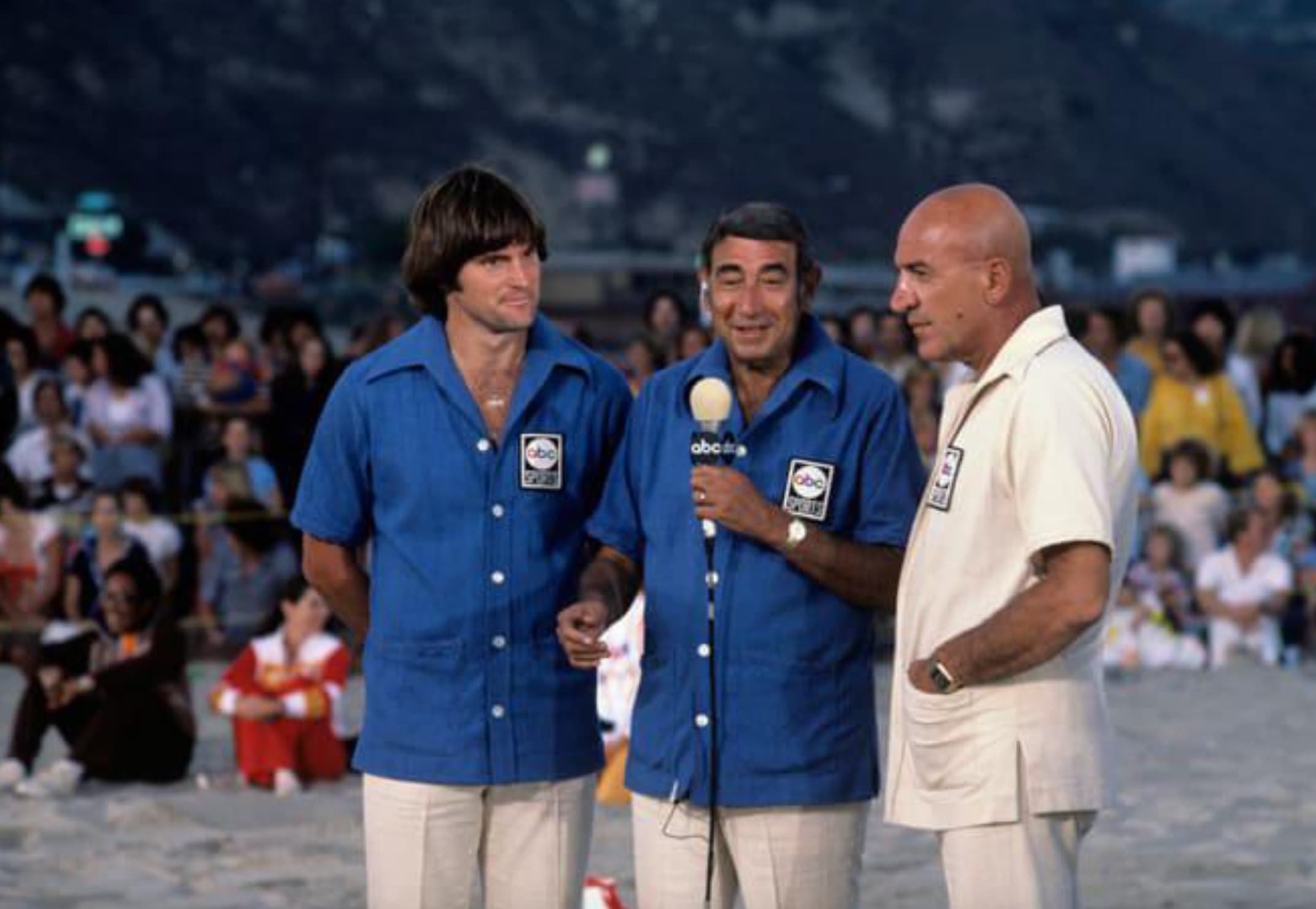 “Battle of the Network Stars with (L to R) [Caitlyn] Jenner, Howard Cosell, and Telly Savalas, 1984.”